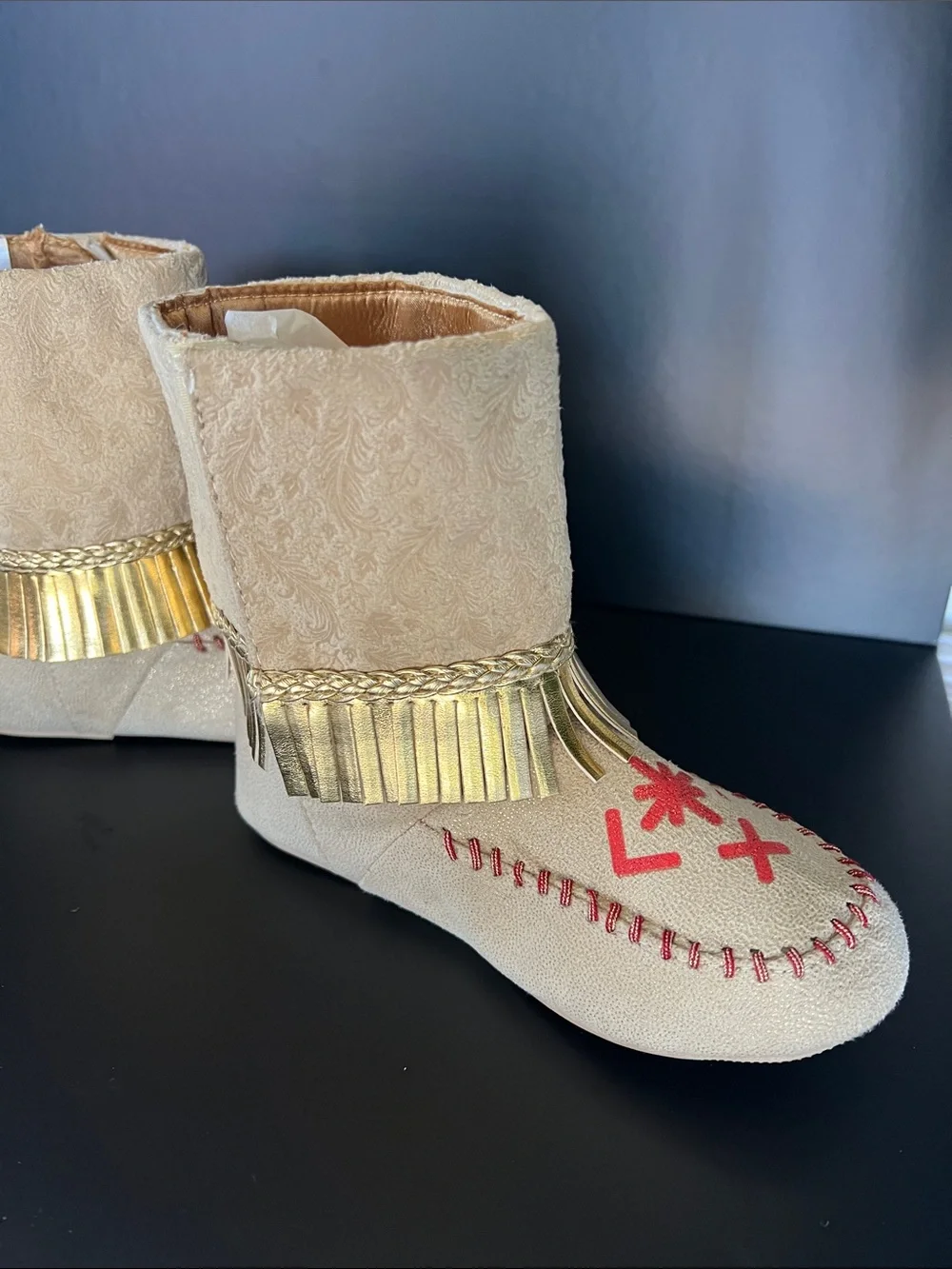 Disney Beige Moccasin Boots with Gold Fringe and Red Embroidery